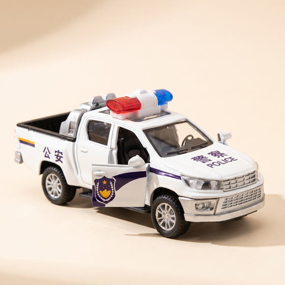 Diecast Ford pickup police toy car on warm cream studio background